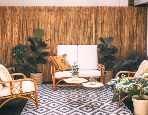 Budget-friendly patio privacy ideas with a DIY tension rod curtain on a small apartment balcony