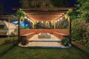 Hot tub pergola with cozy patio string lights backyard