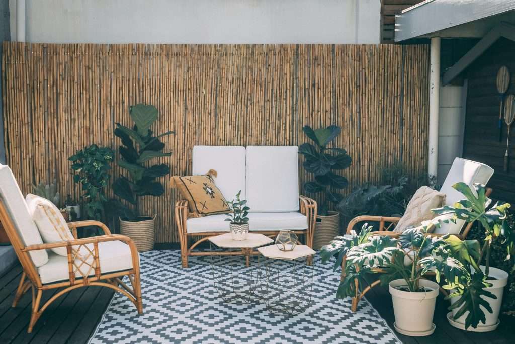 Bohemian small patio ideas on a budget with rugs and plants