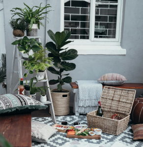 Bohemian small patio setup with rattan furniture